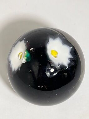 Source Unknown Black Glass Floral Paperweight with White and Yellow Flowers